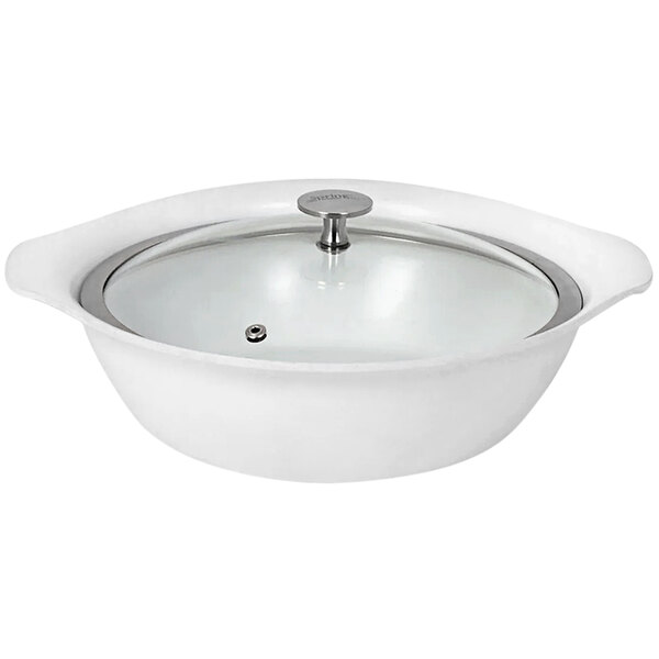 A white Spring USA casserole pan with a glass lid.