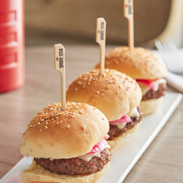 Customizable Boat Oar Picks in a row on a plate of mini burgers.