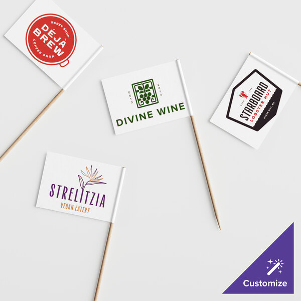 A group of small white rectangular flags with different designs on a white surface.