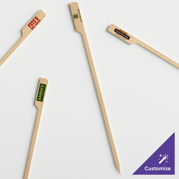 A customizable wooden boat oar pick with red text.