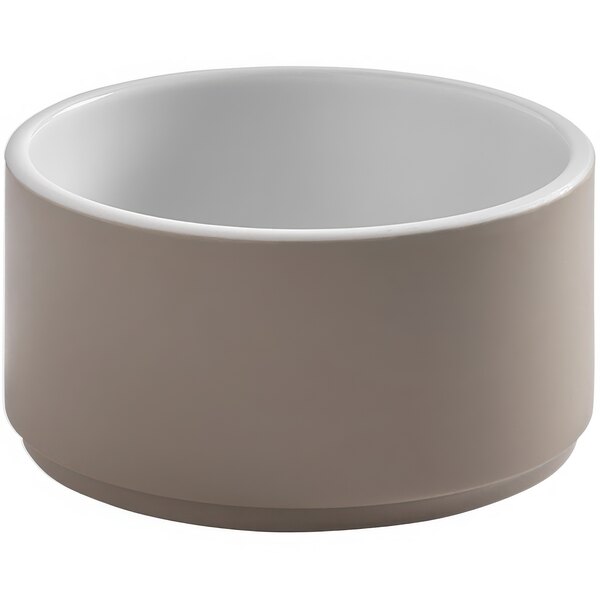 A white bowl with a brown base and white rim.