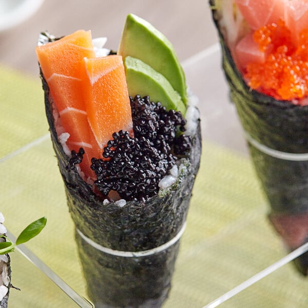 A sushi roll with Cavi-Art Vegan Black Caviar on top.