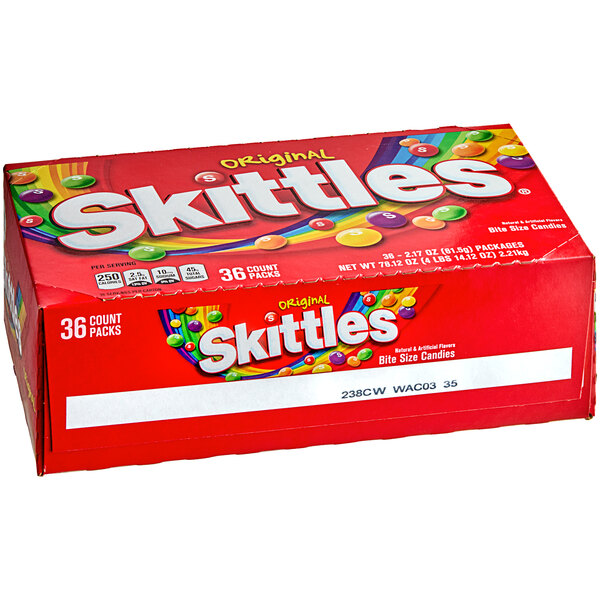 A red pouch of Skittles Original Fruity Candies with colorful candies.
