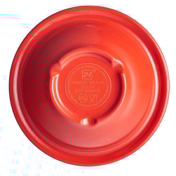 A red plastic Thunder Group melamine bowl with a logo on it.