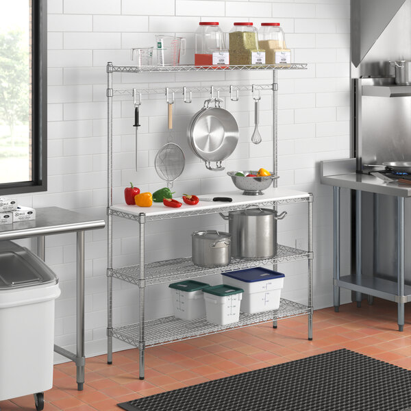 A Regency baker's rack shelf in a kitchen with pots and pans.