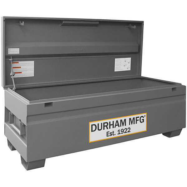 A large grey Durham Mfg job site box with a white label.