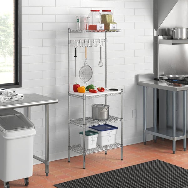 A kitchen with a Regency chrome baker's rack shelf over a sink.