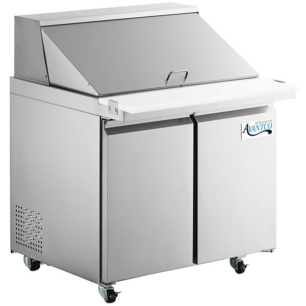 An Avantco stainless steel sandwich prep table with two doors and a cutting top.