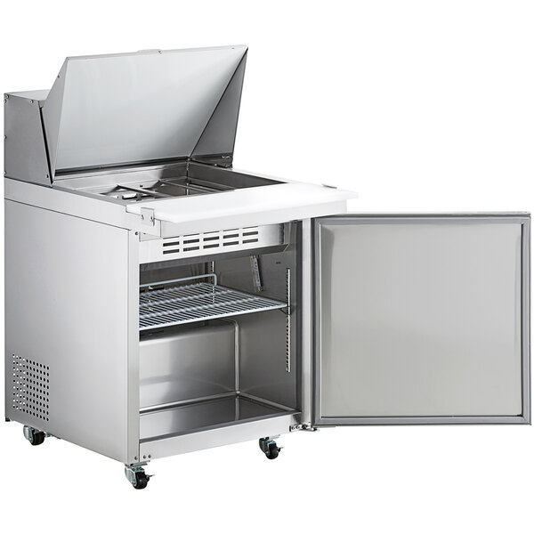 An Avantco stainless steel refrigerator with a door open.