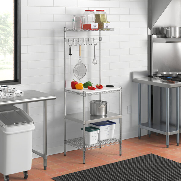 A Regency chrome baker's rack with wire and stainless steel shelves in a kitchen.