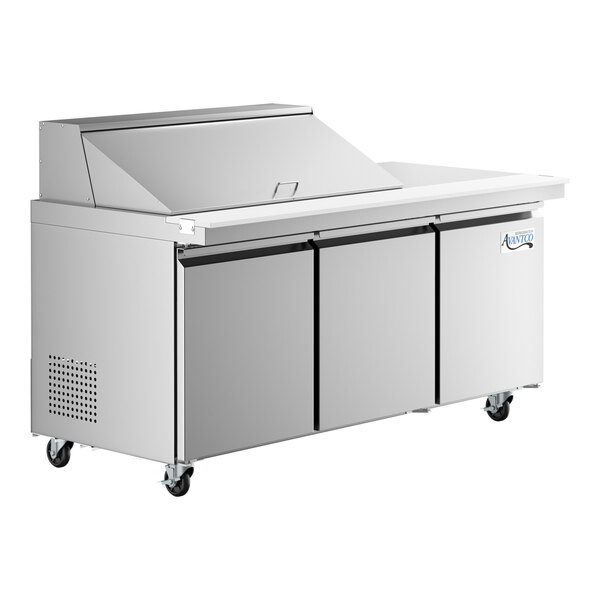 An Avantco stainless steel refrigerated sandwich prep table with three doors on wheels.