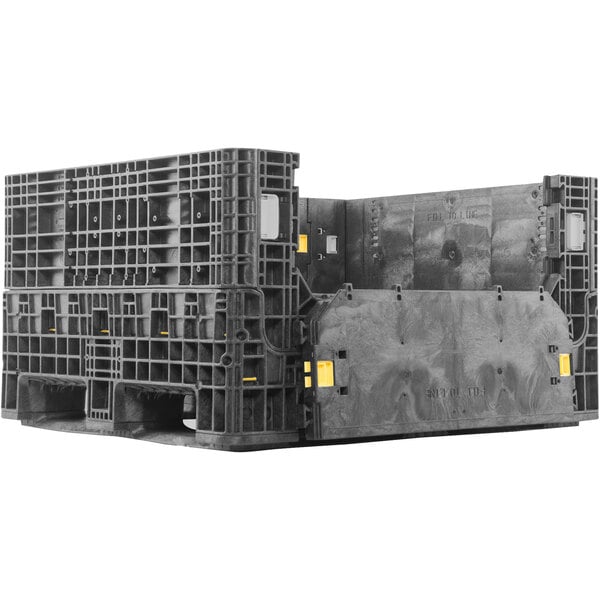 A black Orbis collapsible container with two doors on a black plastic pallet.