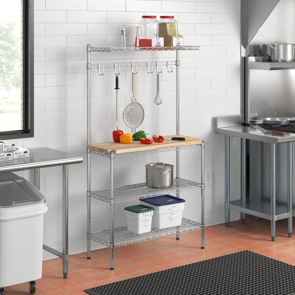 A kitchen with a Regency chrome wire shelf with a hardwood cutting board on the counter.