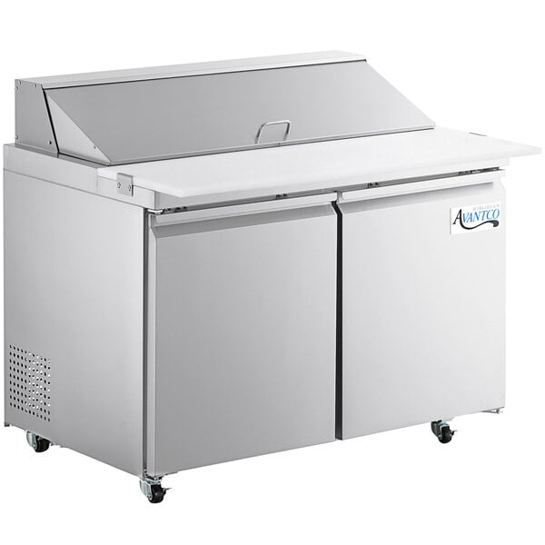 An Avantco stainless steel refrigerated sandwich prep table with two doors and extra deep cutting board.