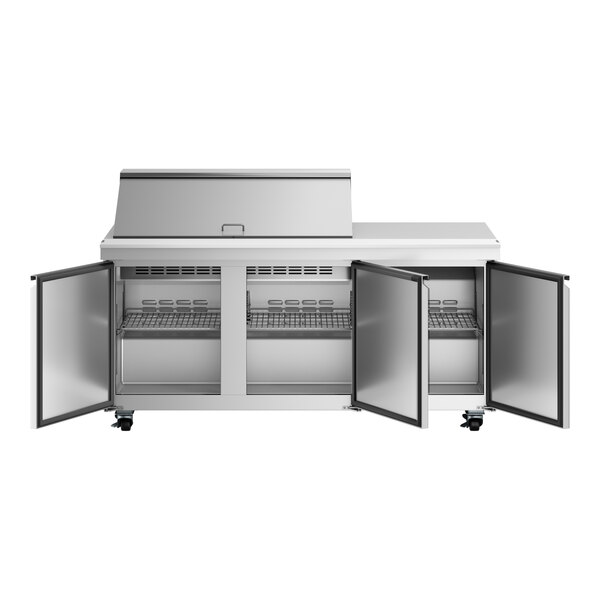 An Avantco stainless steel refrigerator with three doors open.