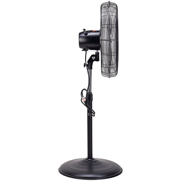 A Tornado industrial black metal pedestal fan on a stand.