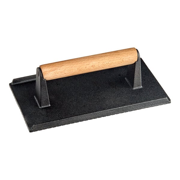 An American Metalcraft cast iron steak weight with a wood handle.