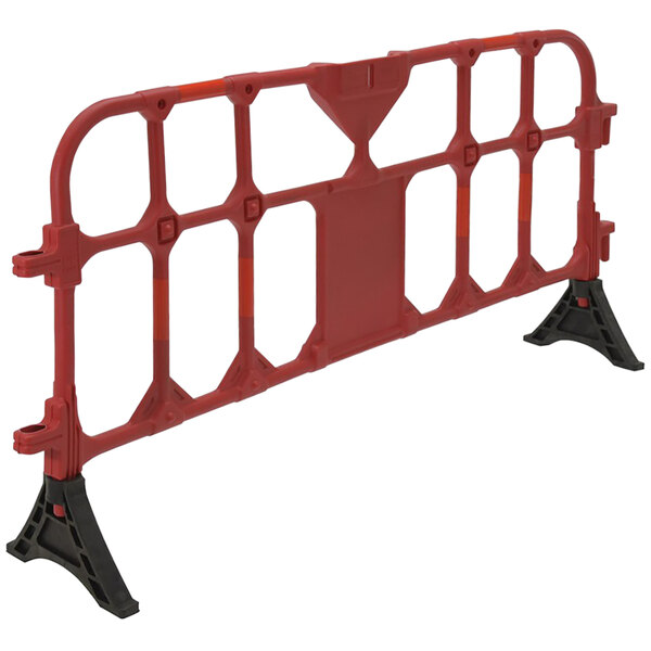 A red plastic barrier on black legs.