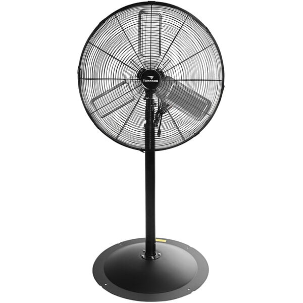 A black Tornado industrial pedestal fan on a white background.