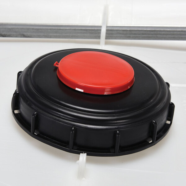 A white Vestil Intermediate Bulk Container with a red and black lid.