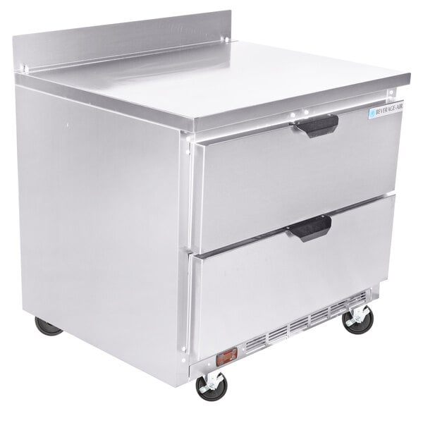 A stainless steel Beverage-Air worktop freezer with two drawers on wheels.