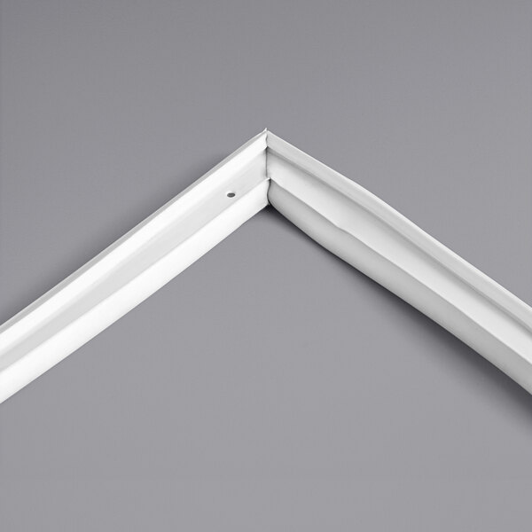 A white corner of an Avantco refrigerator door gasket.