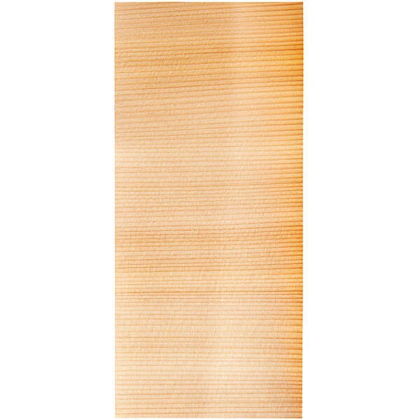 A close-up of a Wildwood Grilling cedar wrap with a thin, light brown stripe.