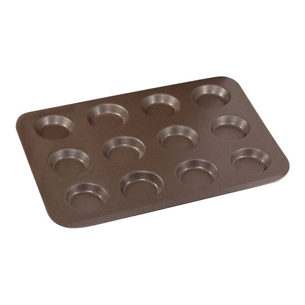 A brown Gobel tartlet pan with 12 cavities.