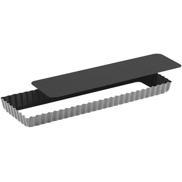 A black rectangular Gobel tart pan with a silver metal strip.