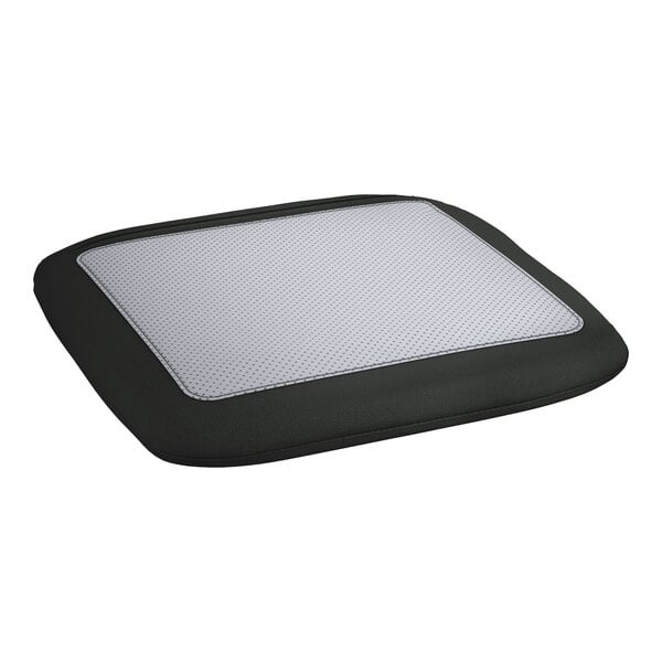 A black and white cushion with a white patch on a Lancaster Table & Seating outdoor cafe barstool.