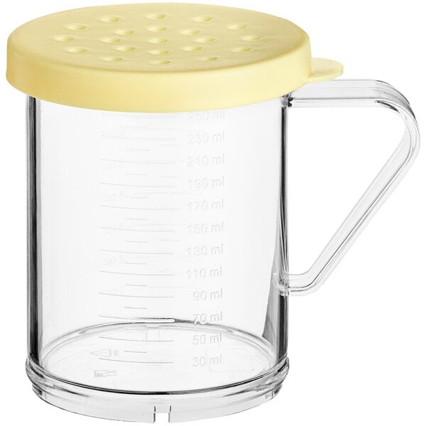 A clear polycarbonate shaker with a yellow lid.