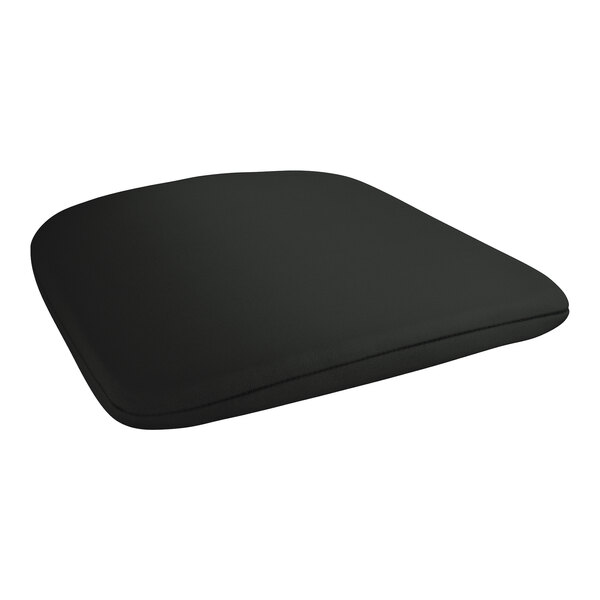 A black cushion on a white Lancaster Table & Seating outdoor arm chair.