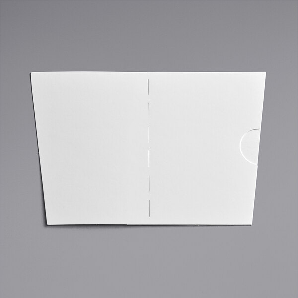 A white poly-coated paper with a dotted line and a hole in the middle.