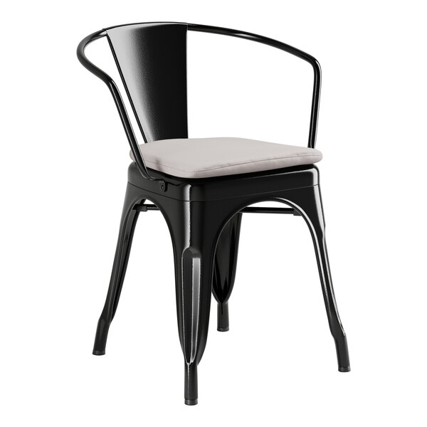 A black Lancaster Table & Seating outdoor arm chair with a gray cushion.