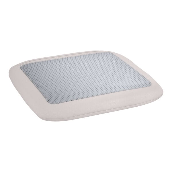 A white cushion with a gray pattern on it on a Lancaster Table & Seating outdoor backless counter height stool.