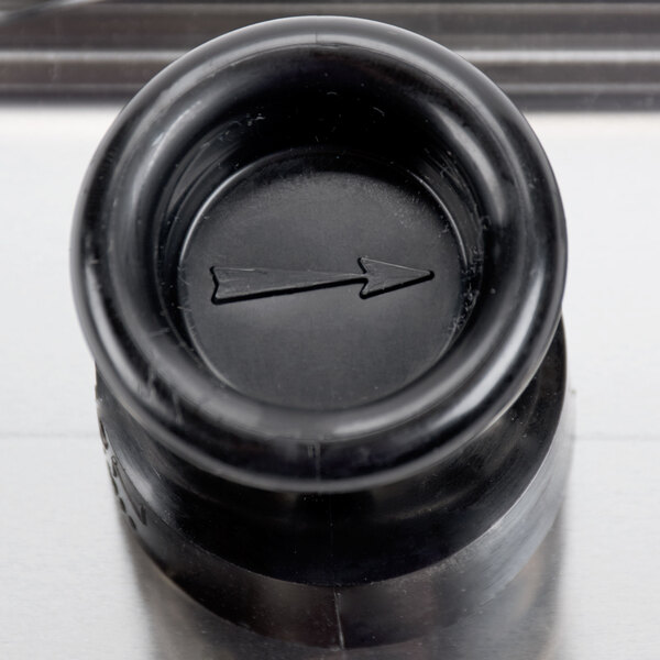 A black plastic guard with an arrow on it.