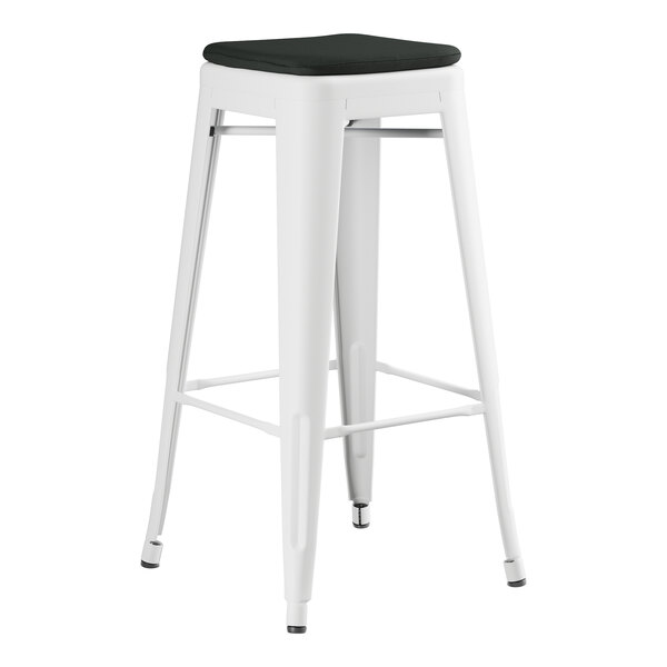 A Lancaster Table & Seating white outdoor barstool with a black cushion on the seat.