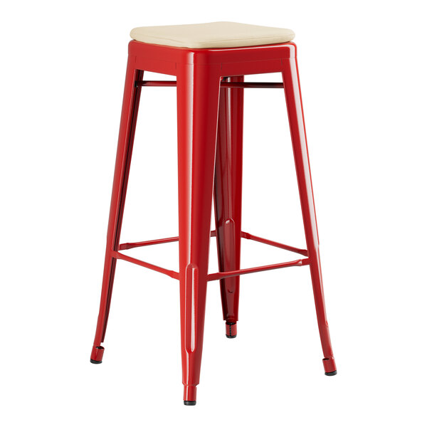 A Lancaster Table & Seating Ruby Red Outdoor Backless Barstool with a Tan Fabric Seat