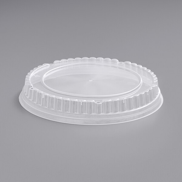 A clear plastic lid with a round edge.