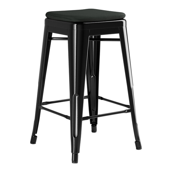 A Lancaster Table & Seating black outdoor backless counter height stool with a black cushion.