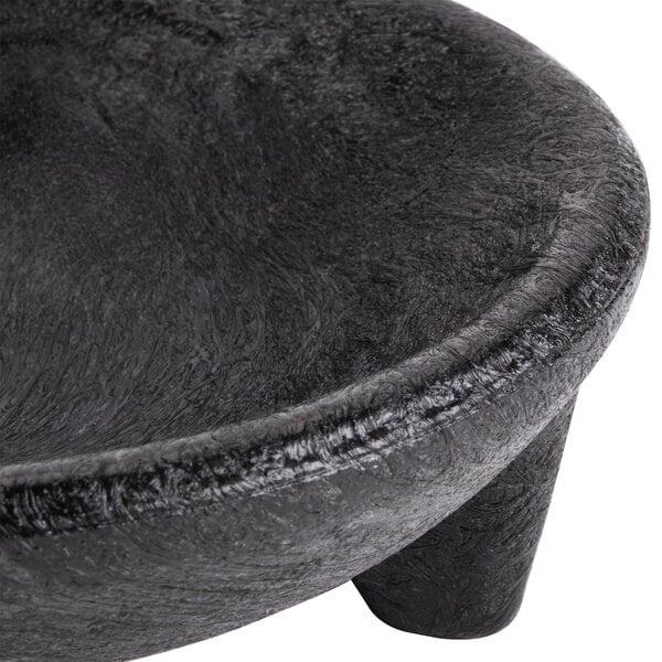 A black polypropylene molcajete with a handle.