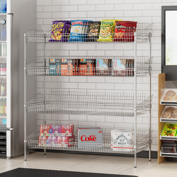 A Regency chrome retail storage display stand with food and snacks on metal shelves.