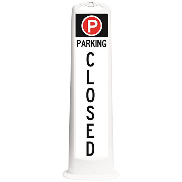 A white rectangular Cortina parking sign with black letters that says "Parking Closed"
