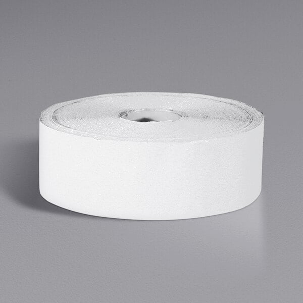 A roll of white Cortina Construction Grade pavement marking tape.