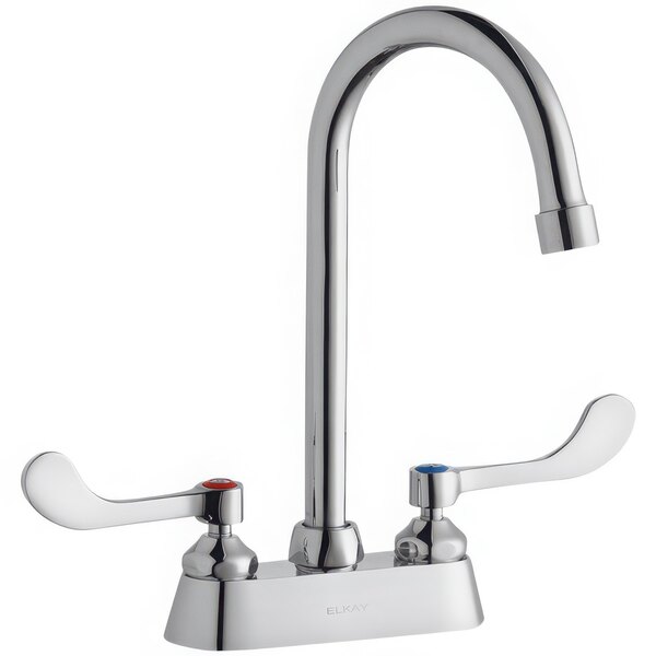 A silver deck-mount faucet with 4" wristblade handles and a 5" gooseneck swing spout.