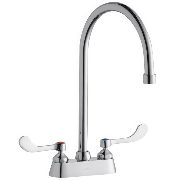 A silver Zurn Elkay deck-mount faucet with gooseneck spout and wristblade handles.