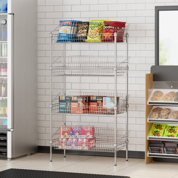 A Regency chrome retail storage display stand with shelves of snacks and drinks.
