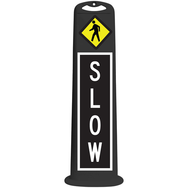 A black vertical sign with white and yellow text that reads "Slow Pedestrian Crossing" with a man walking on it.