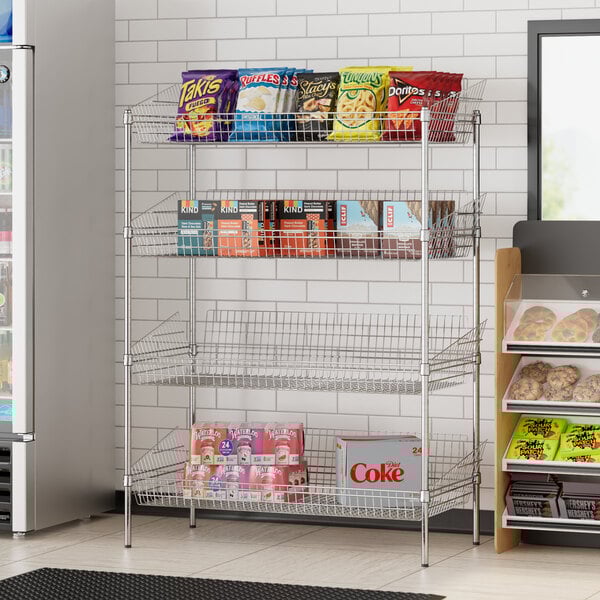 A Regency chrome metal retail storage display stand with baskets of snacks on it.