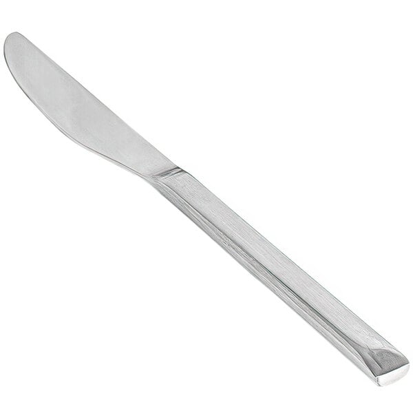 The front of a silver stainless steel dinner knife with a brushed finish.